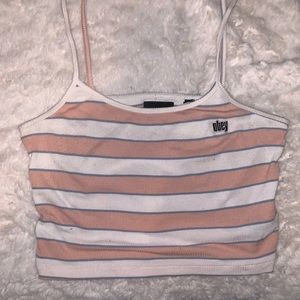 Pink and white cropped tank top. Says it’s a small but runs around a medium.